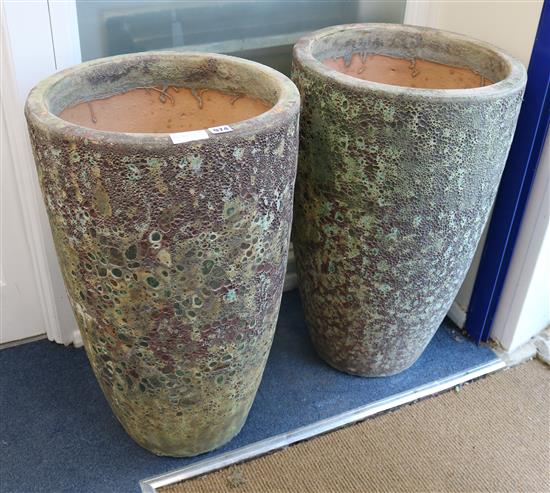 A pair of volcanic style pots W.45cm
